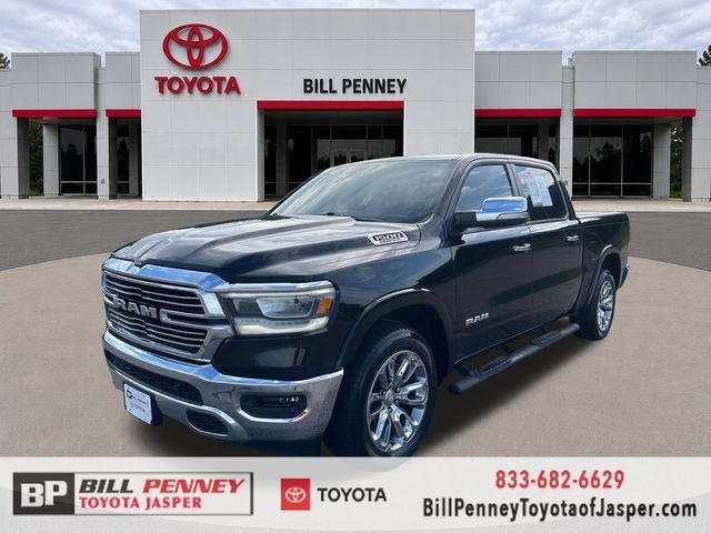2019 RAM 1500 Laramie in Diamond Black Crystal Pearlcoat — front three-quarter view