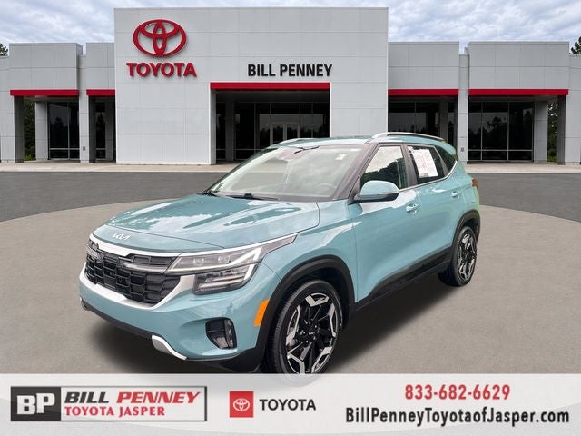 2024 Kia Seltos SX in Pluton Blue — front three-quarter view